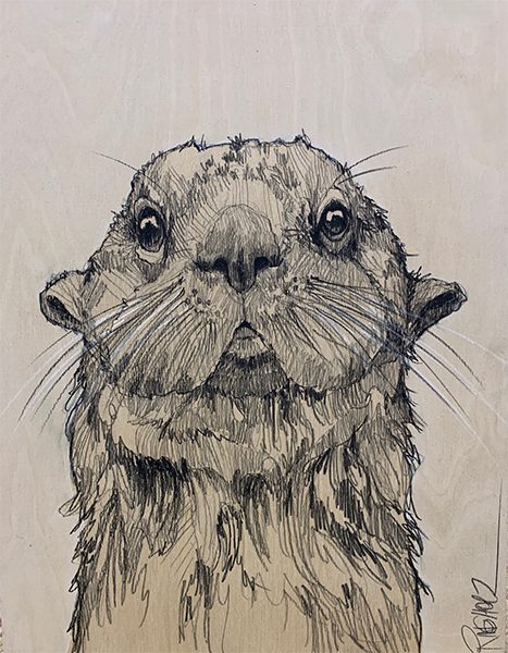 A drawing of an otter on wood.