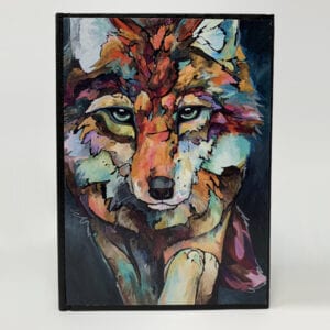 A colorful painting of a wolf on a SMALL JOURNAL - OUT OF THE DARK.