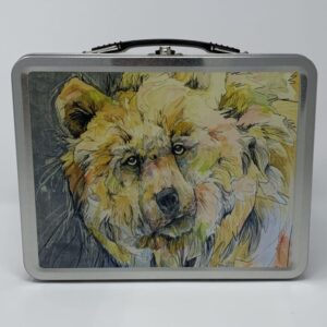 A paint box with a painting of a bear on it.