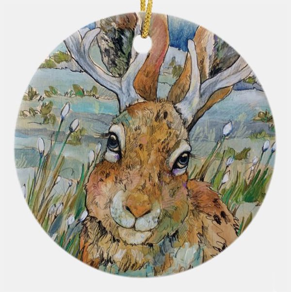A painting of a hare with antlers christmas ornament.