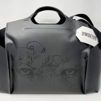 A black EQPD WideTote with an image of a wolf on it.