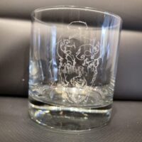 A NEW! - ROCKS GLASS SET with an engraved design on it.