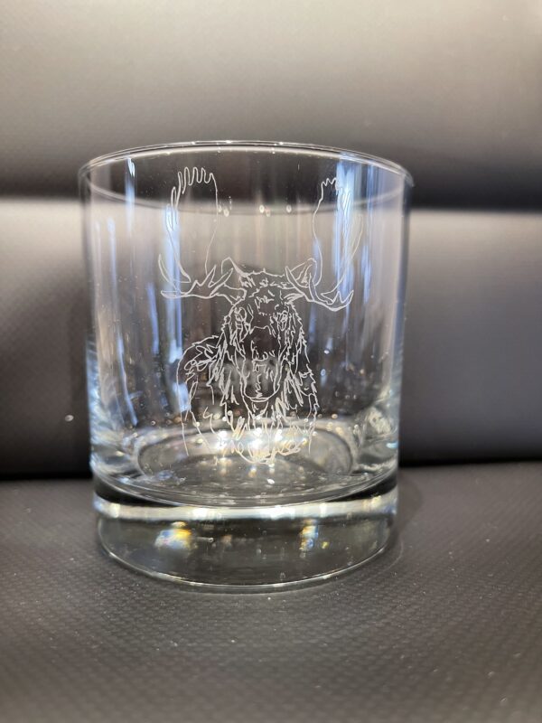 A NEW! - ROCKS GLASS SET with an image of a moose on it.