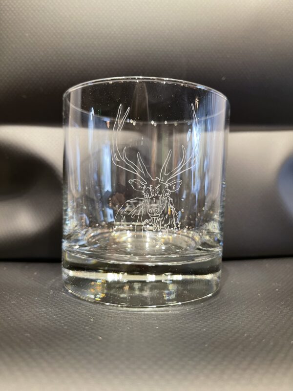 A NEW! - ROCKS GLASS SET with a deer engraved on it.