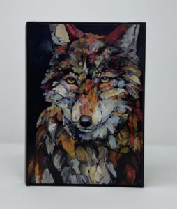 A SMALL JOURNAL - TALL DARK & DEBONAIRE of a wolf on a black background.