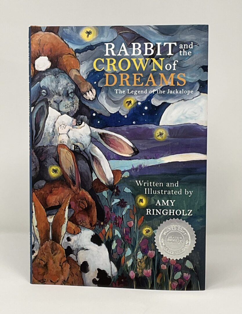 Book cover featuring rabbits and whimsical art.