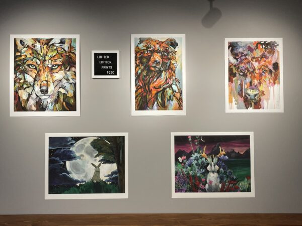 A group of "Emergence" Limited Edition Prints on display in a gallery.