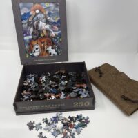 A 250 PIECE WOODEN PUZZLE - "Dreaming Wide Awake" in a box with a picture on it.