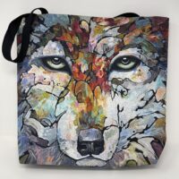 A BRAND NEW LARGE tote bag with an artistic, abstract depiction of a wolf's face.